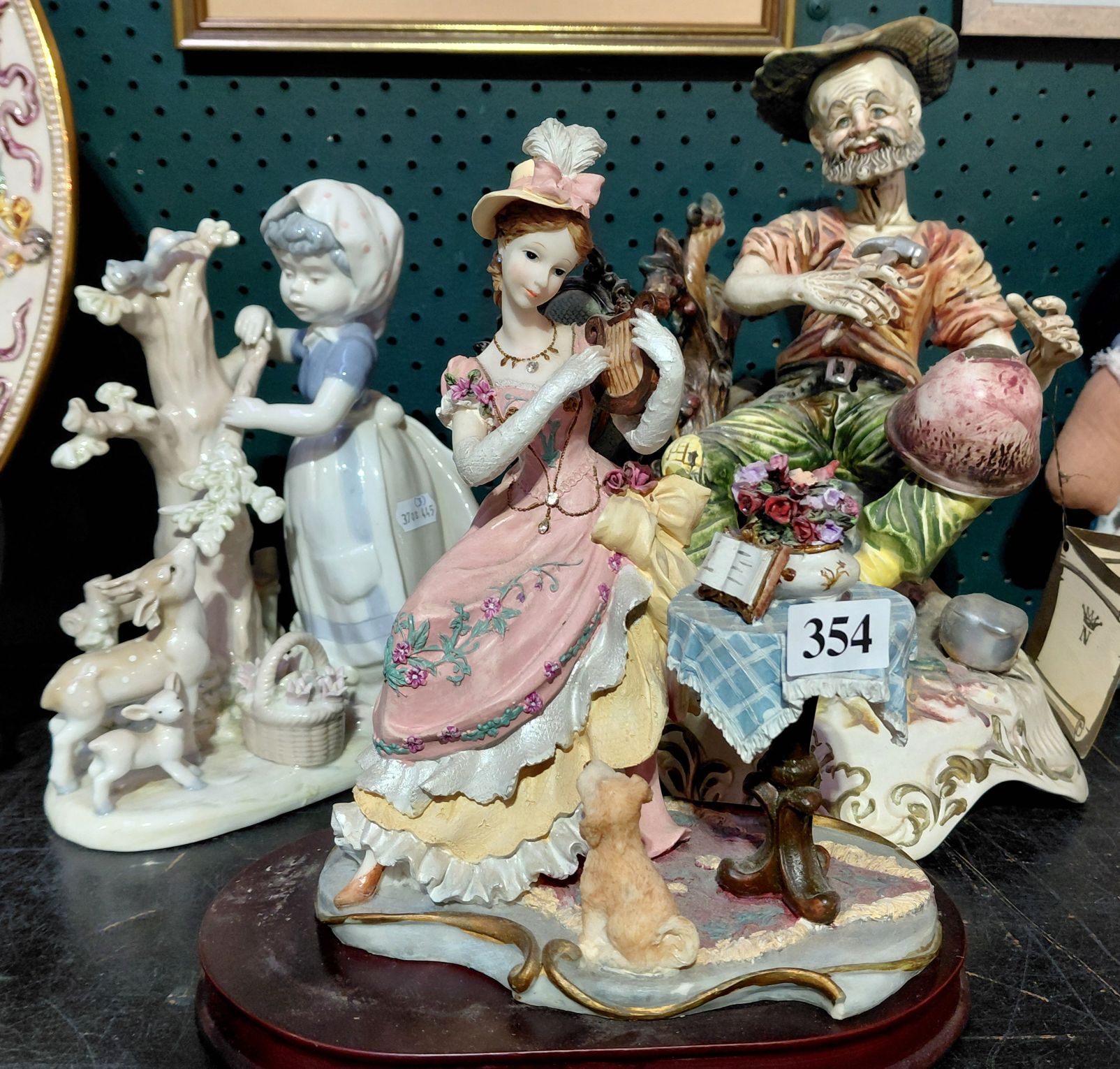 354 · THREE DECORATIVE FIGURINES