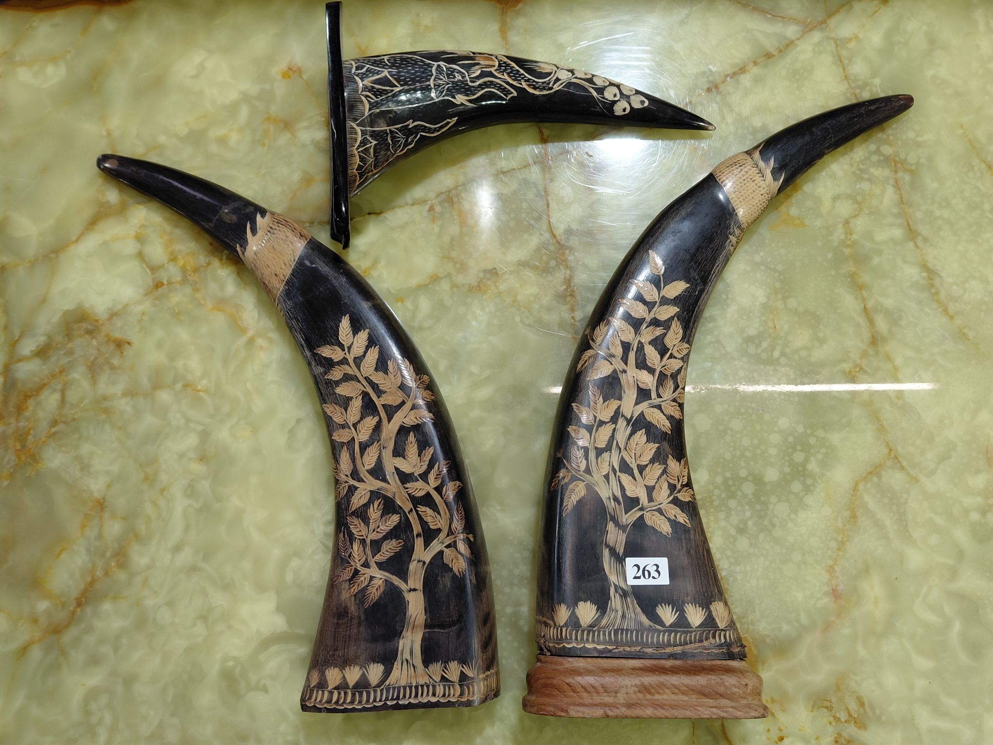 263 · THREE CARVED HORN ORNAMENTS