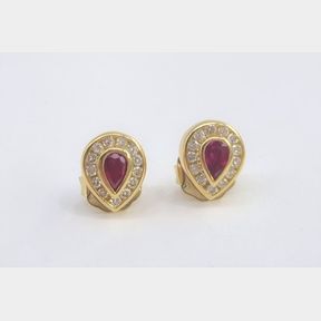 0.60CTS OF RUBIES and 0.65CTS OF 26 DIAMONDS SET IN A PAIR OF 18CT YELLOW GOLD EARRINGS
