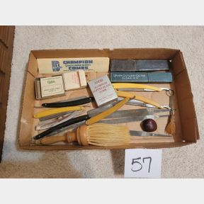 Collection of antique barber razors and accessories