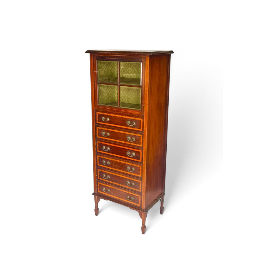 An Edwardian mahogany and satinwood crossbanded music cabinet in the manner of Maple and Co