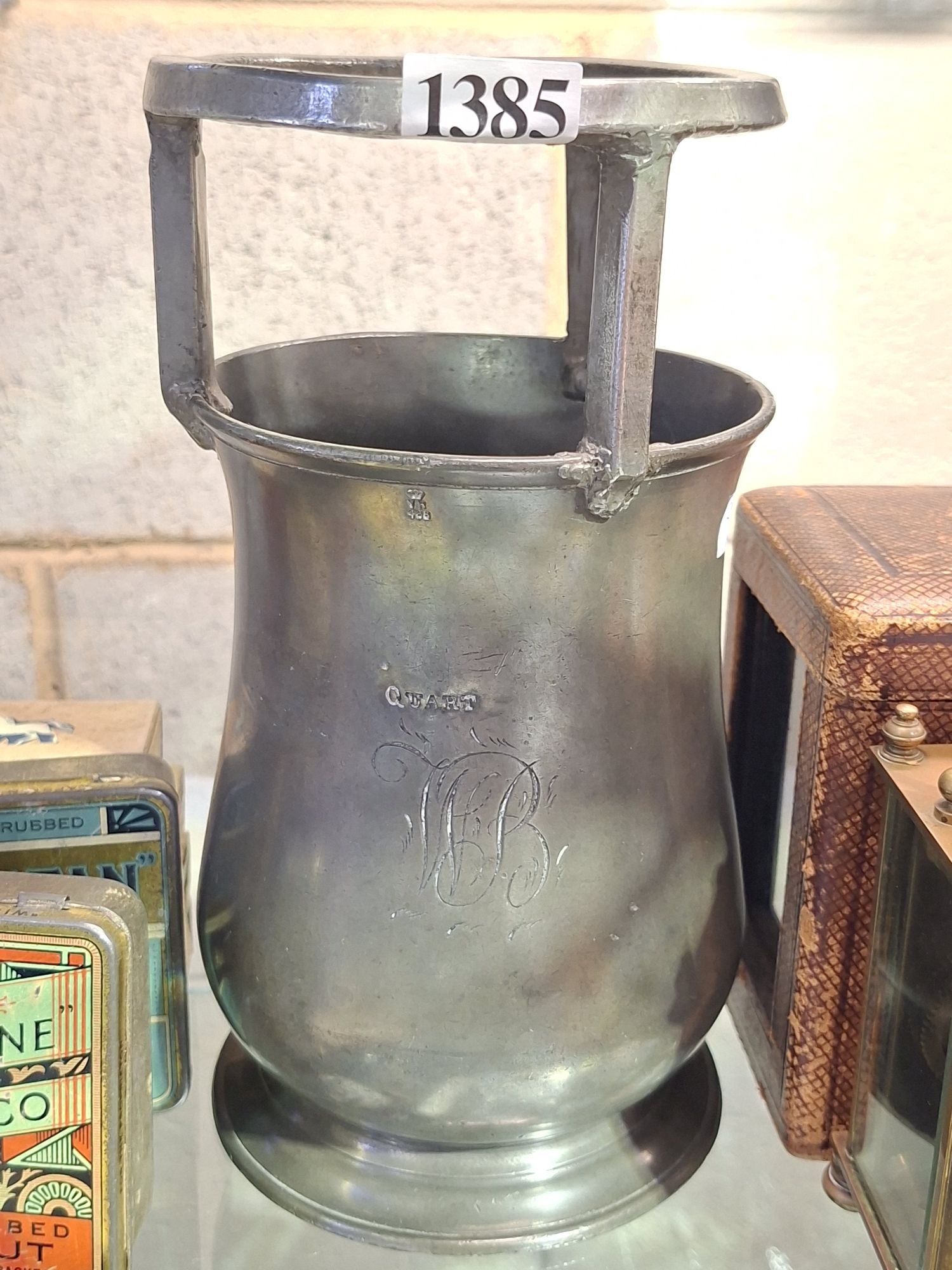 A PEWTER BOTTLE DRAWER/SIZER