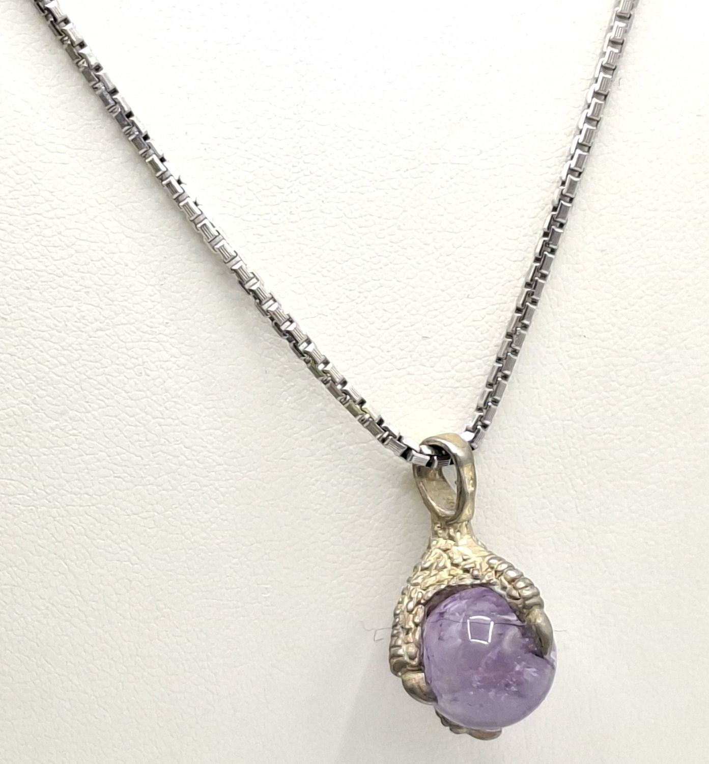Silver And Amethyst Claw Pendant
