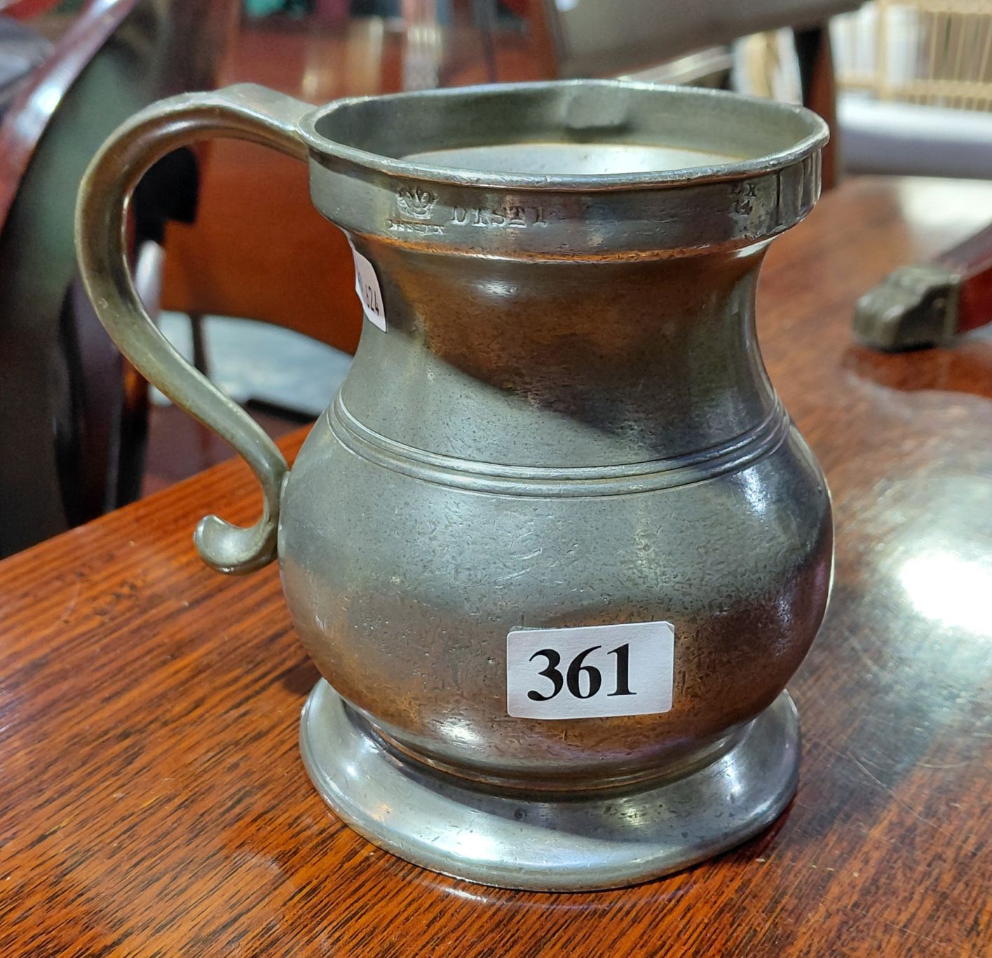 AN IMPERIAL PINT BULBOUS PEWTER WINE MEASURE