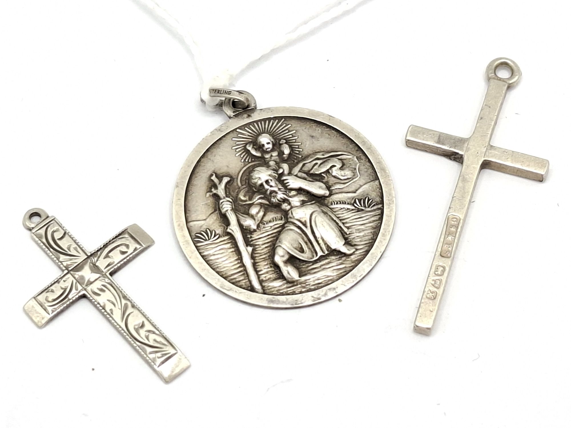 Silver Crosses And Religious Pendant