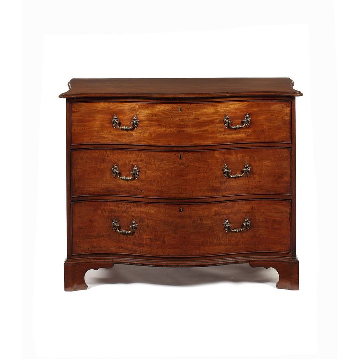 A George III mahogany serpentine chest attributed to Thomas Chippendale