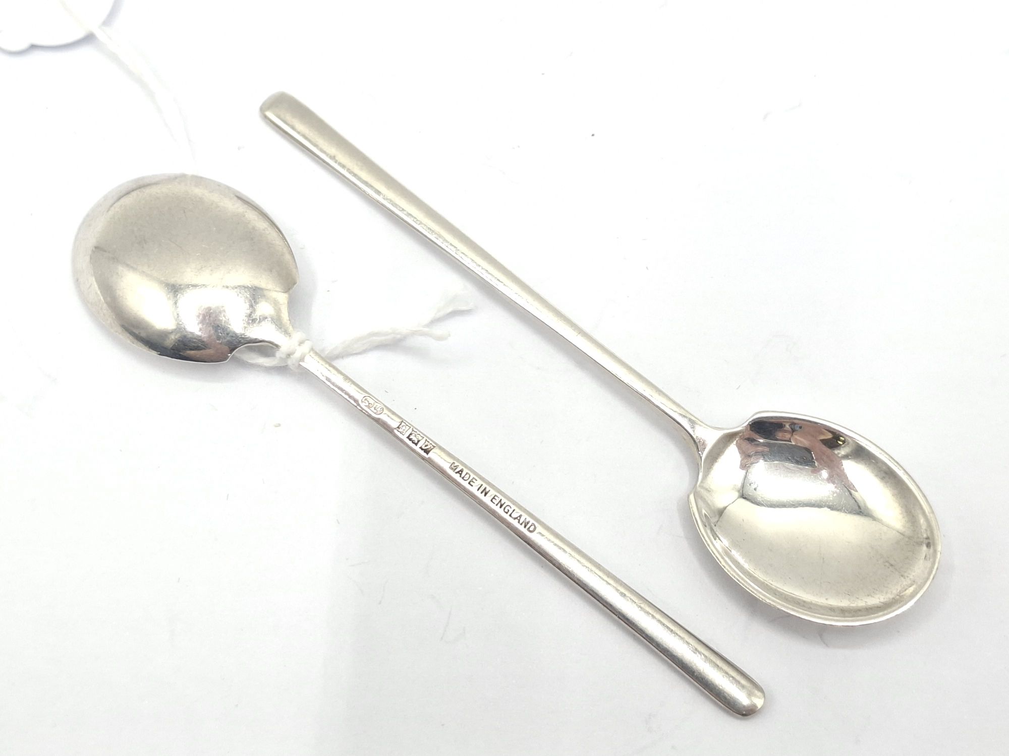 A PAIR OF ENGLISH SILVER SUGAR SPOONS