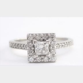 0.723CTS DIAMONDS INCLUDING 0.2830CT PRINCESS CENTRE DIAMOND COLOUR E CLARITY SI1 IN 18CT WHITE GOLD RING