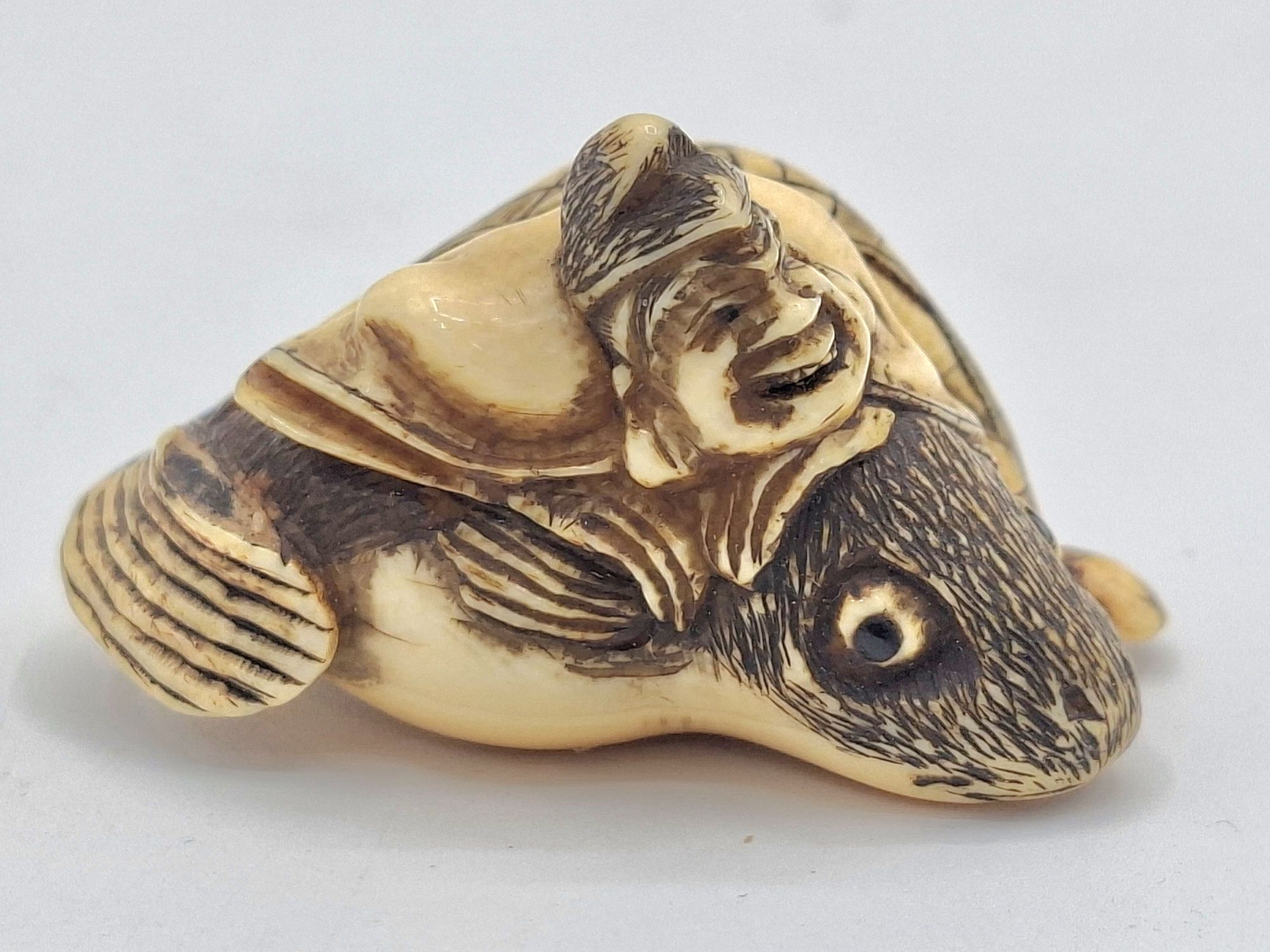 14 · JAPANESE CARVED IVORY NETSUKE