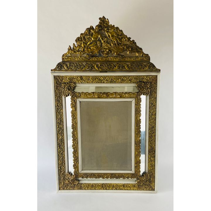 A Louis XIV style pressed gilt brass and later white painted marginal mirror