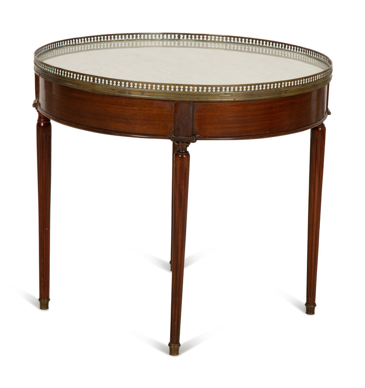 A Louis XVI Style Mahogany Marble-Top Bouillotte Table
Height 25 x diameter of top 27 1/2 inches.