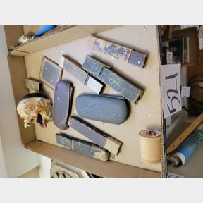Antique razor and eye glass cases, and old man ash tray