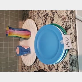 Large platter, colorful vase, lidded mug, plastic platees
