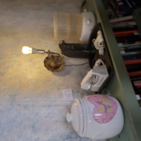 Kitchen items on shelf top, elec can opener, mixer