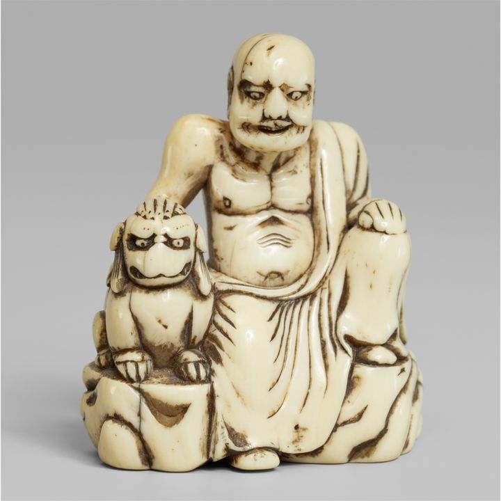 An ivory netsuke of a rakan. Second half 18th century