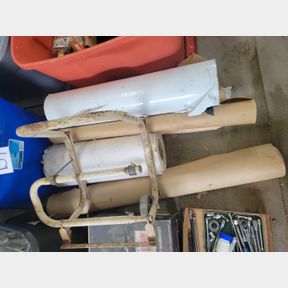 Paper and plastic rolls with paper cutter rack