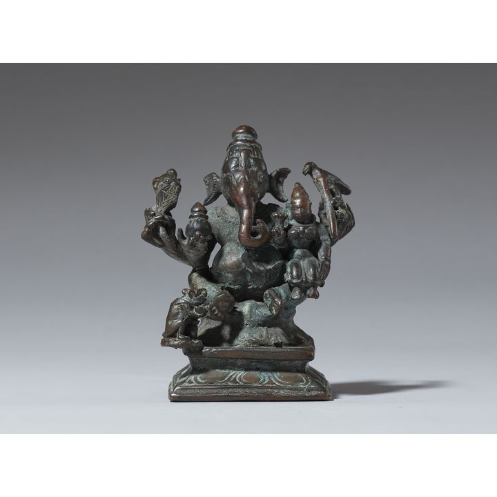 A copper alloy figure of Ganesha with his shakti. India. 19th century