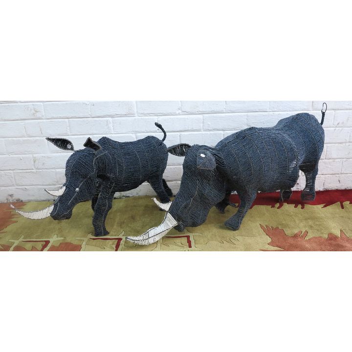 TWO BEADED RHINOS,