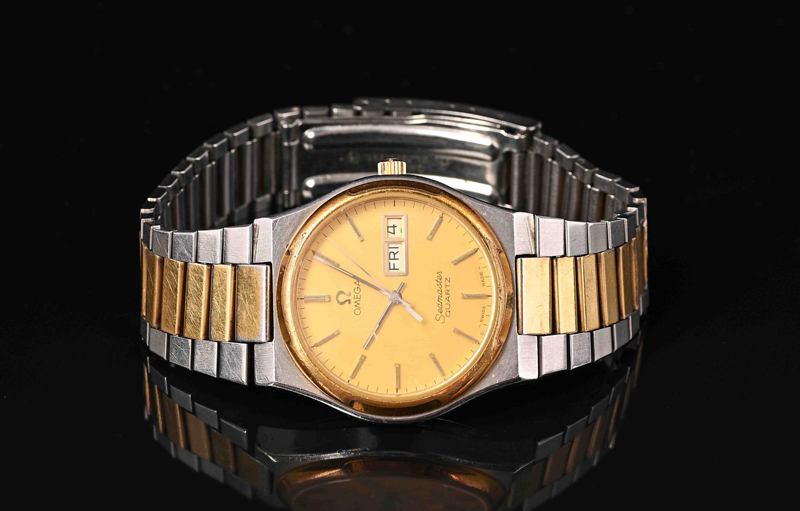 Gents Omega Seamaster quartz watch, gold colour dial, gold colour bezel,  Stainless steel and gold colour strap, 34mm | Russell Kaplan Auctioneers