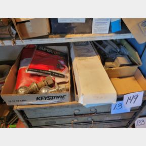 2 Boxes of tow balls, muffler clamps and misc.