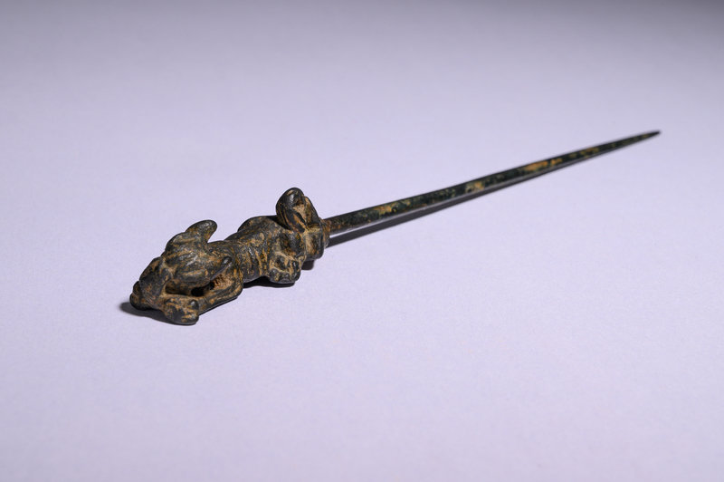 A Near Eastern Bronze Pin with Dog Terminal
Length 8 3/16 inches (21 cm).