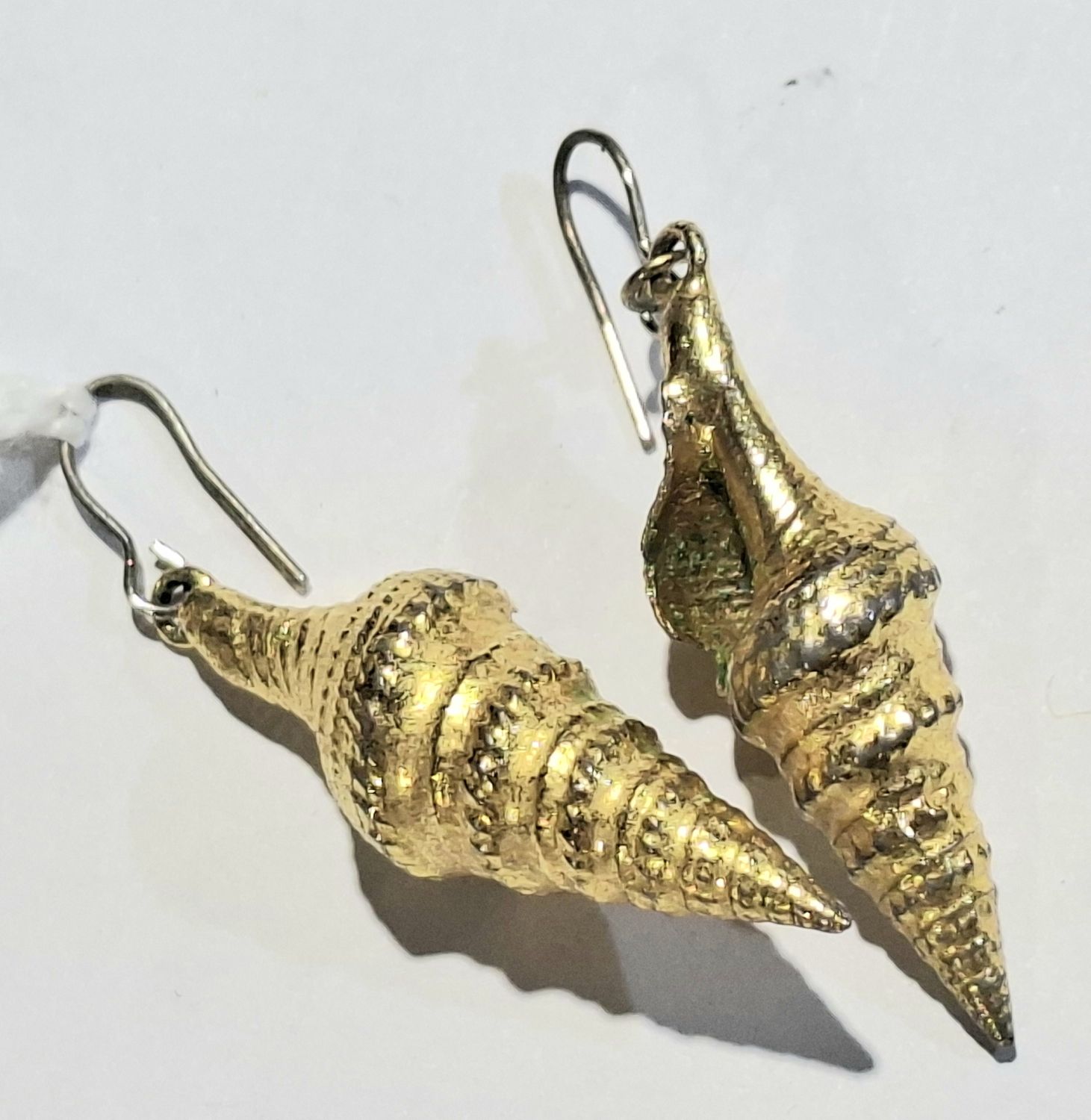A PAIR OF CORNUCOPIA SHELL EARRINGS
