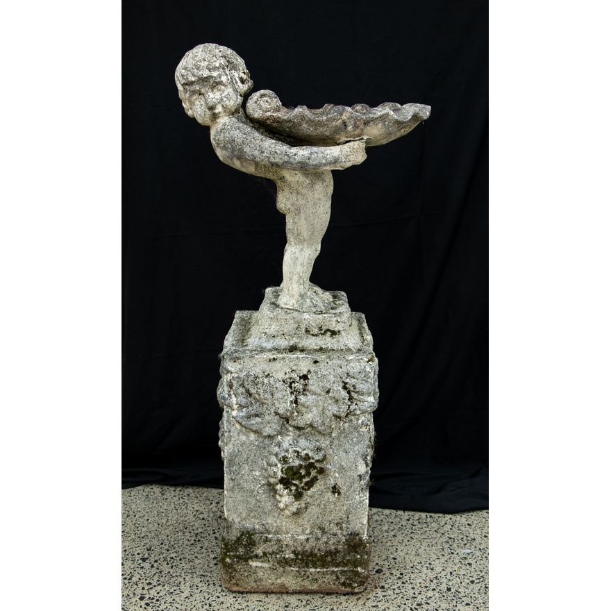 An old concrete bird bath