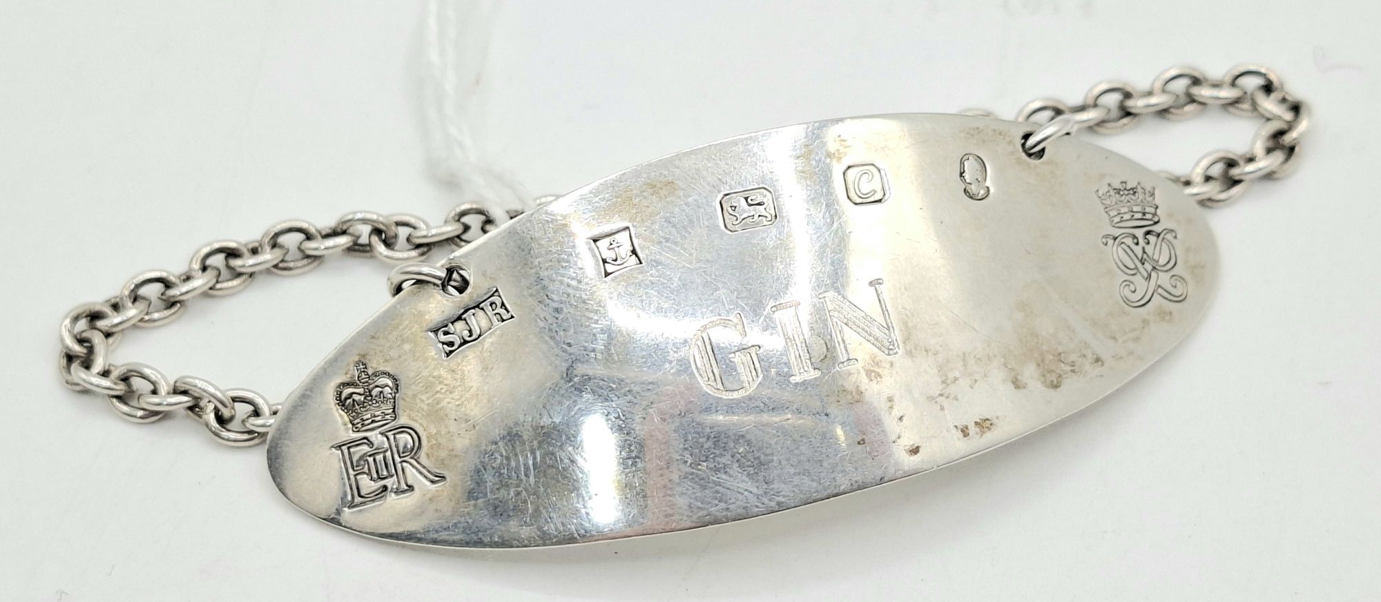 38 · STERLING SILVER GIN LABEL
