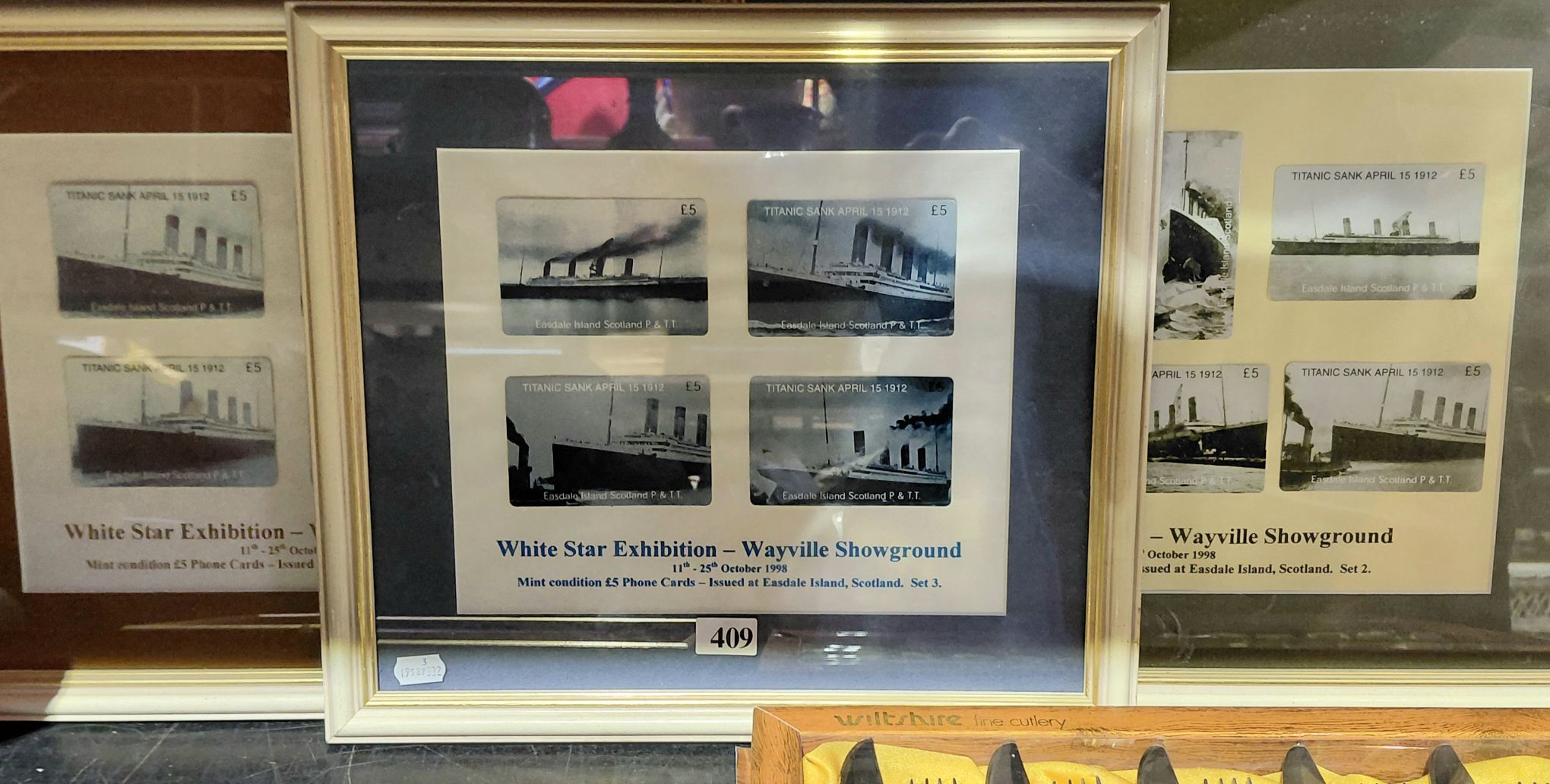 409 · FRAMED PHONE CARDS