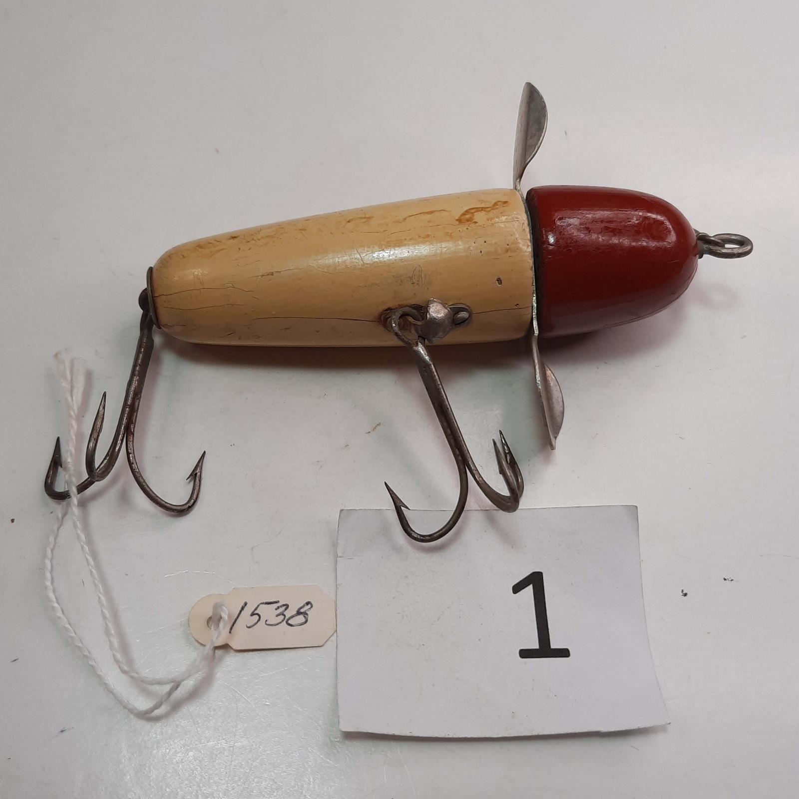 This old wood fishing lure is a Pflueger Globe and it comes with the  original box.This large lure was probably used for Musky fishing as it  measures