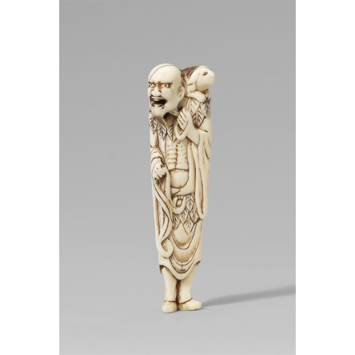 An ivory netsuke of a sennin with a long-haired dog. 18th century