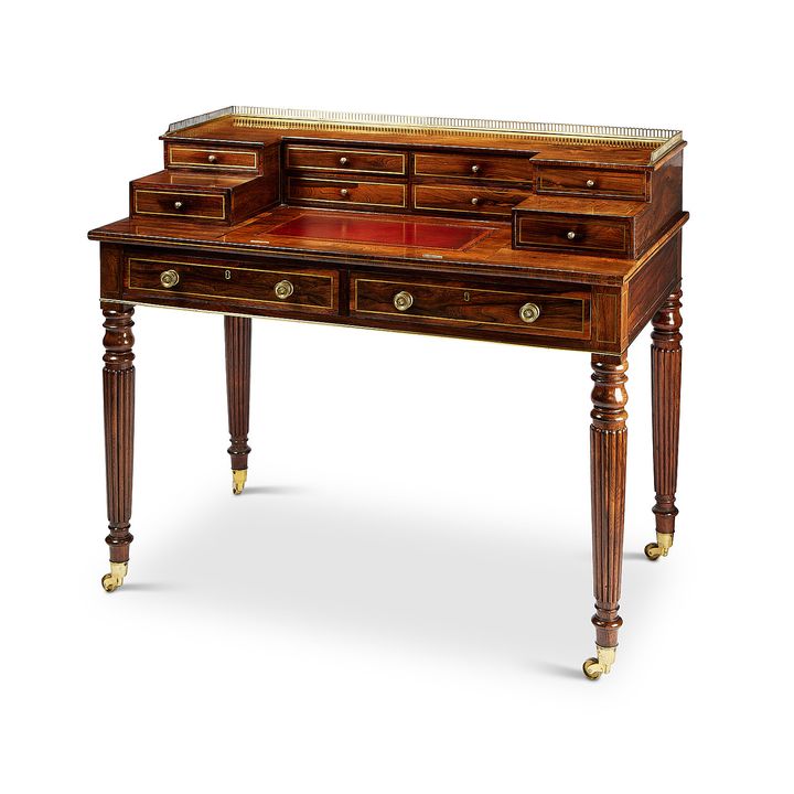 A Regency rosewood and brass inlaid writing desk