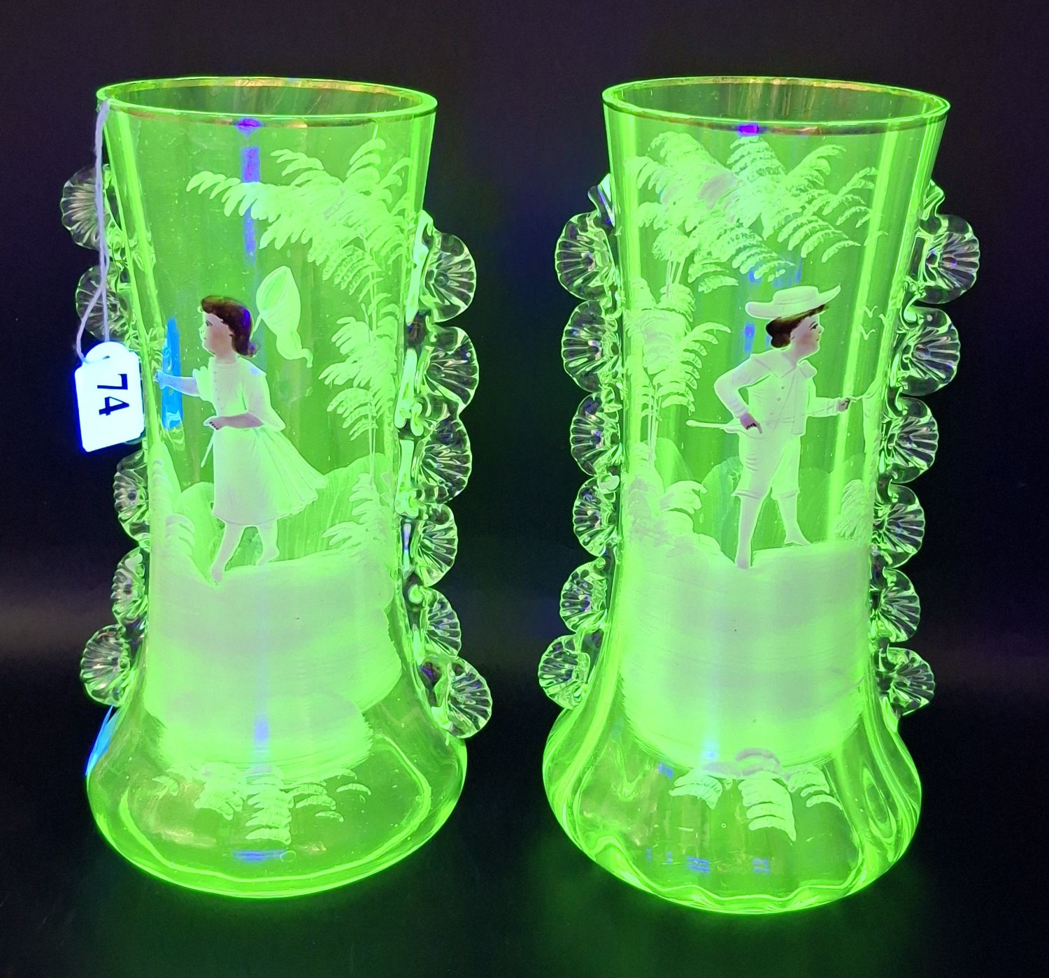74 · A PAIR OF URANIUM GLASS MARY GREGORY VASES