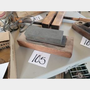 Pair of sharpening stones with antique wood holder