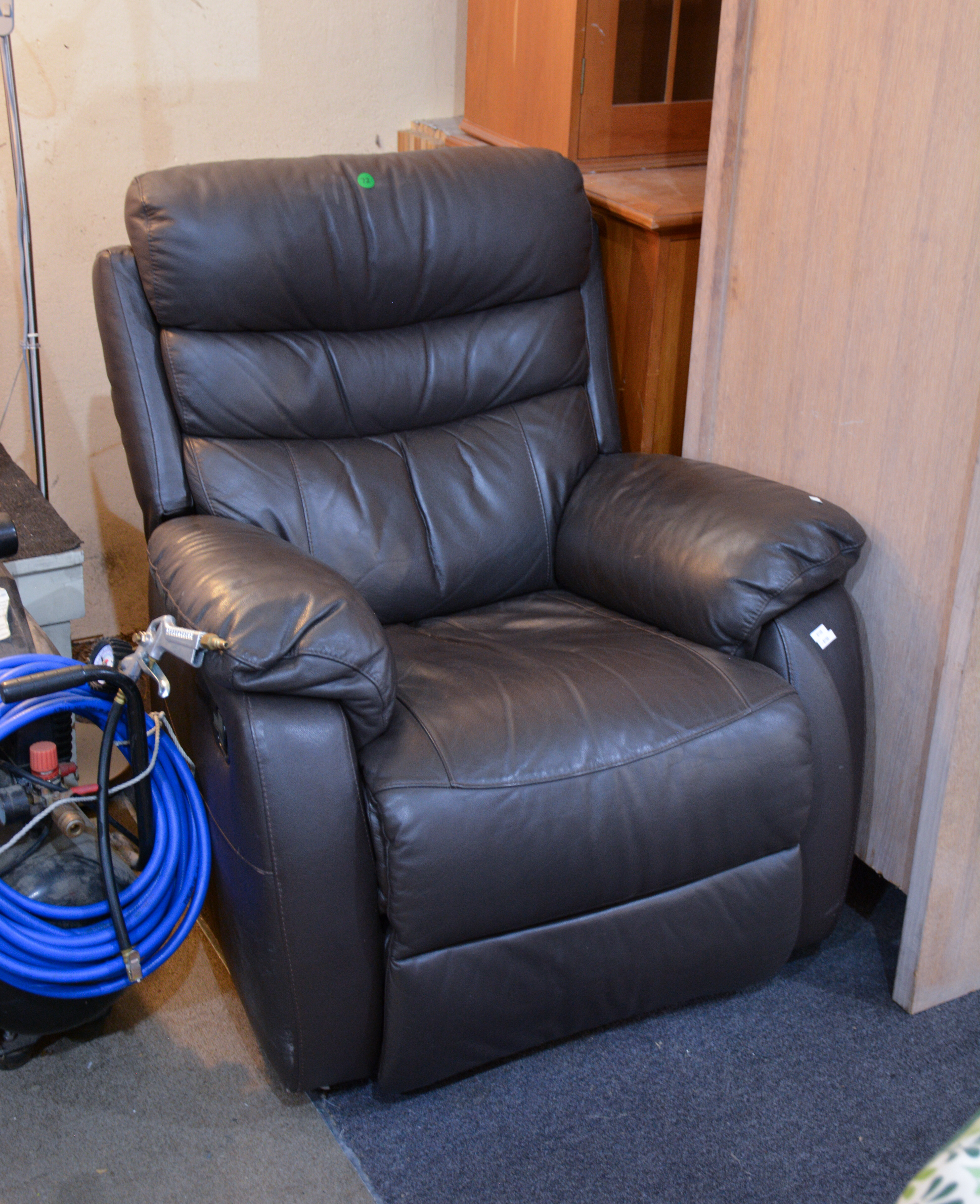 Chocolate Brown Leather Recliner Armchair — sold at auction in New Zealand for $60