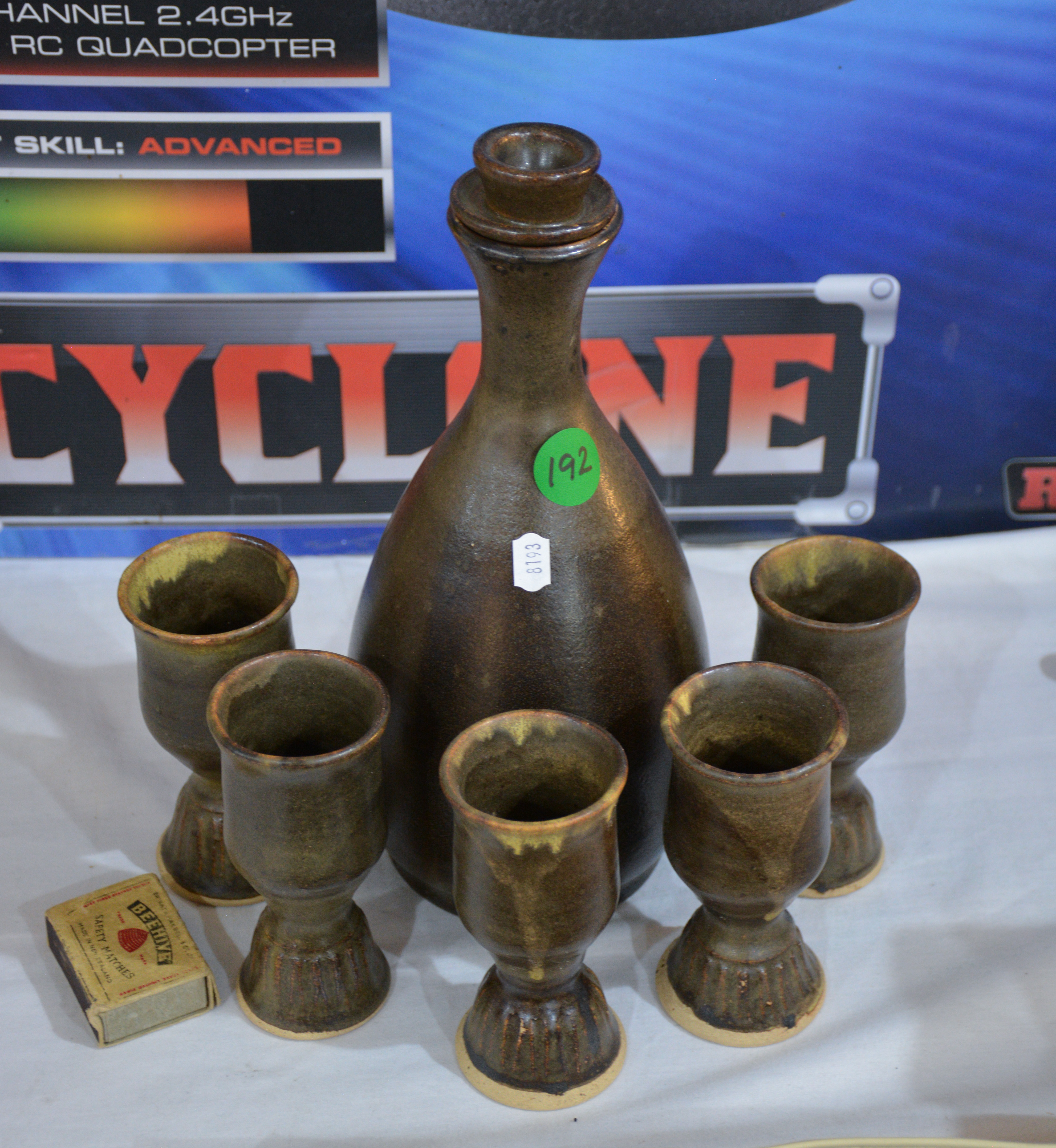 Pottery Decanter and Cups x 5 — sold at auction in New Zealand for $15