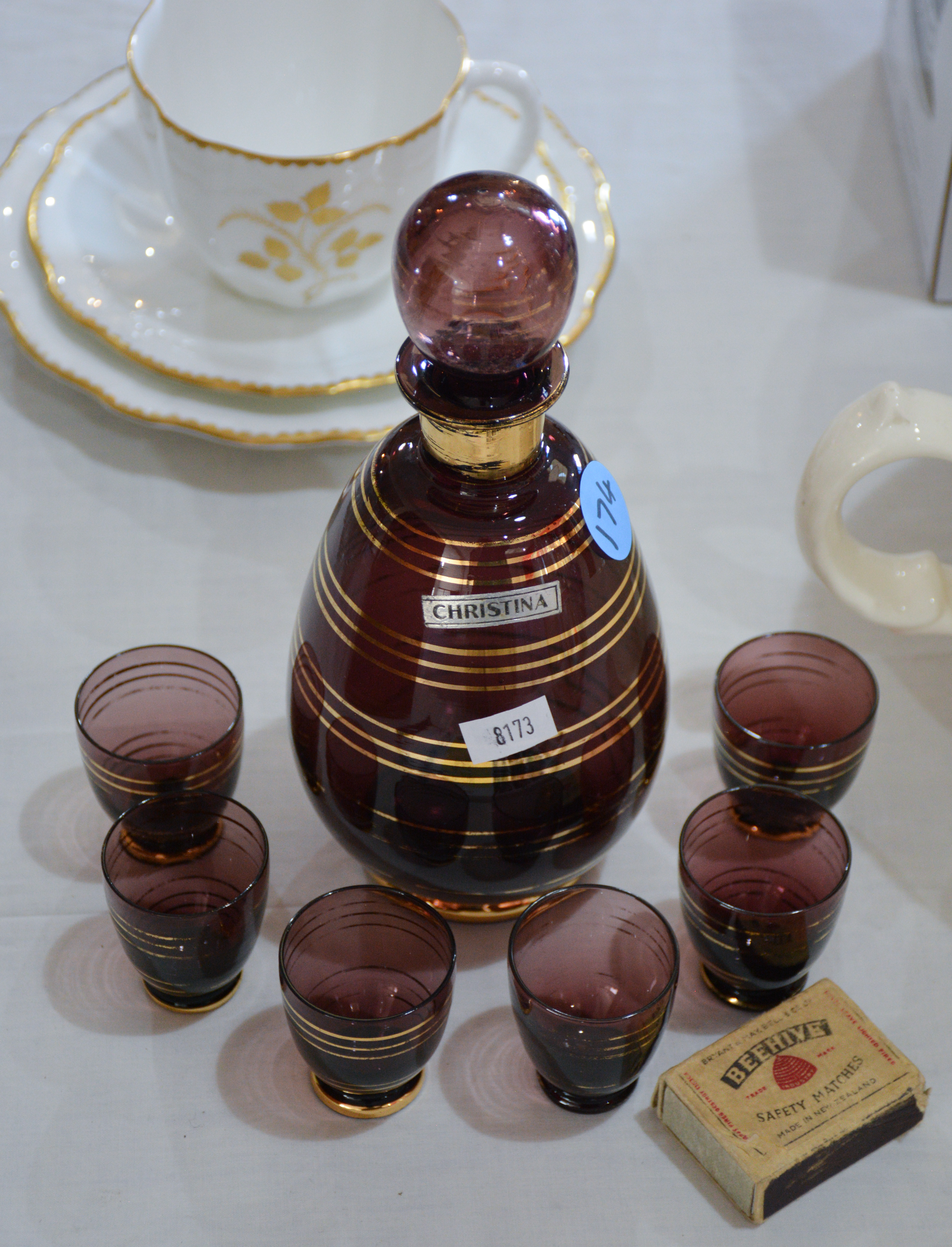 Gilded Purple Glass Decanter and Glasses x 6 — sold at auction in New Zealand for $5