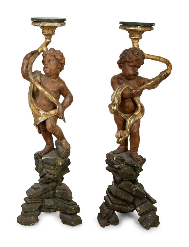 A Pair of Italian Painted and Parcel Gilt Figural Torcheres
Height 56 x diameter 17 inches.