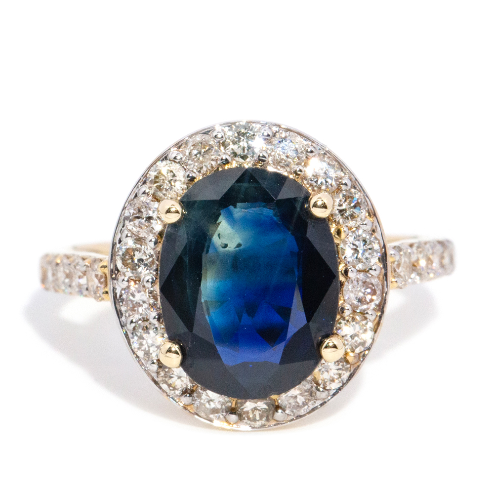 154 · 3.71 Carat Dark Blue Sapphire & Diamond Halo Ring in 14ct Gold