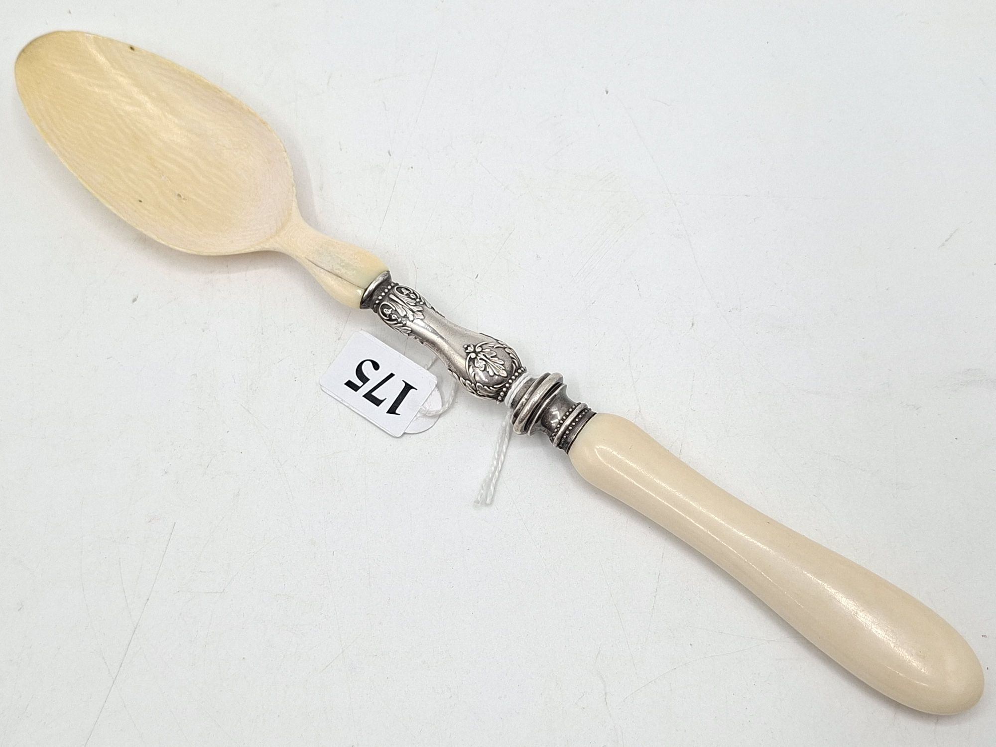 175 · ANTIQUE IVORY AND SILVER SPOON