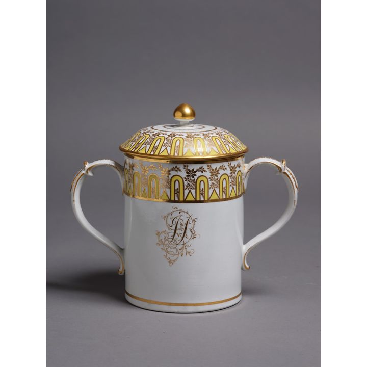 Decorative two handled chocolate cup