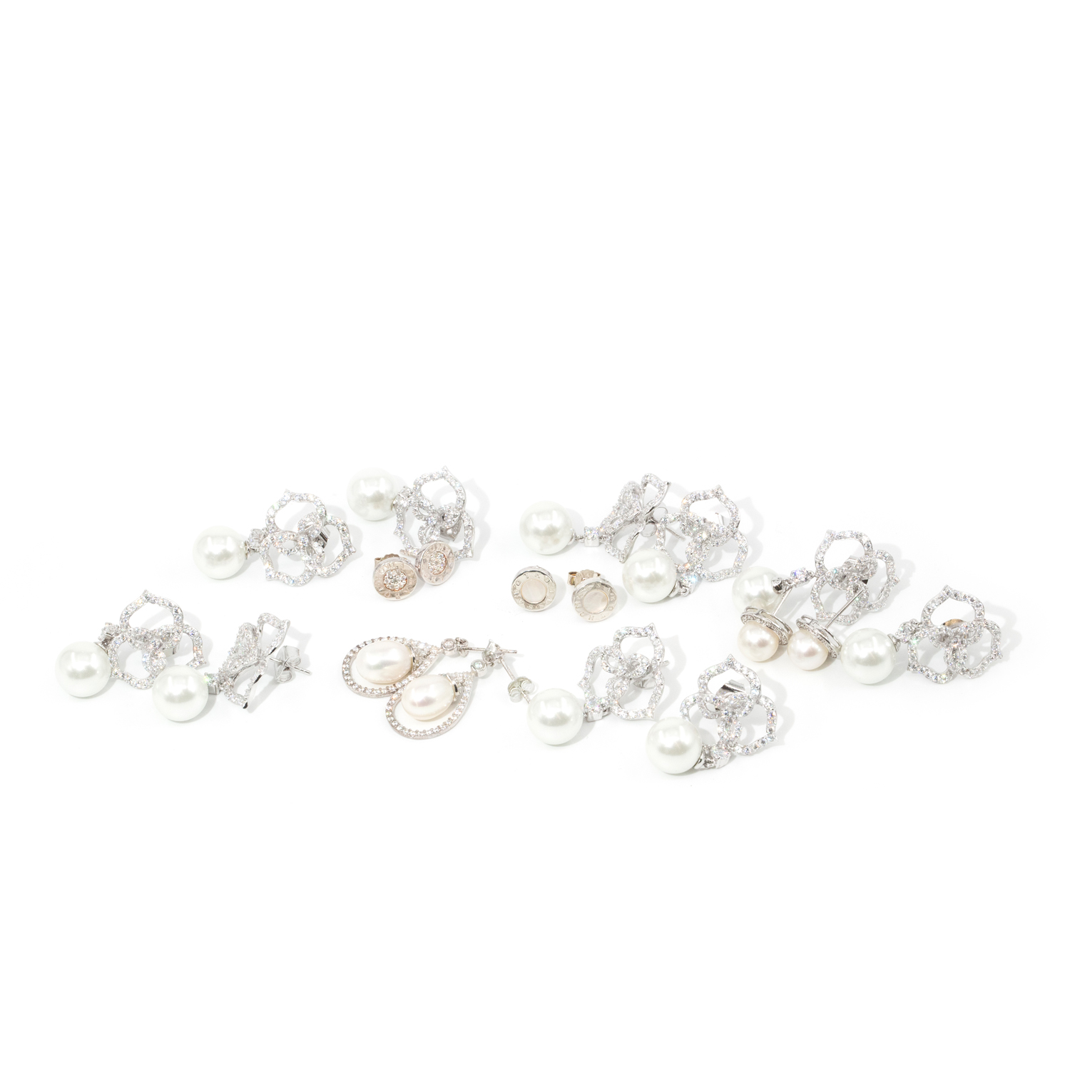 9 Pairs of Silver Earrings