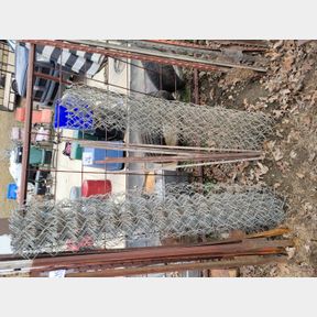2 Small rolls of chain link fence and tightener rods