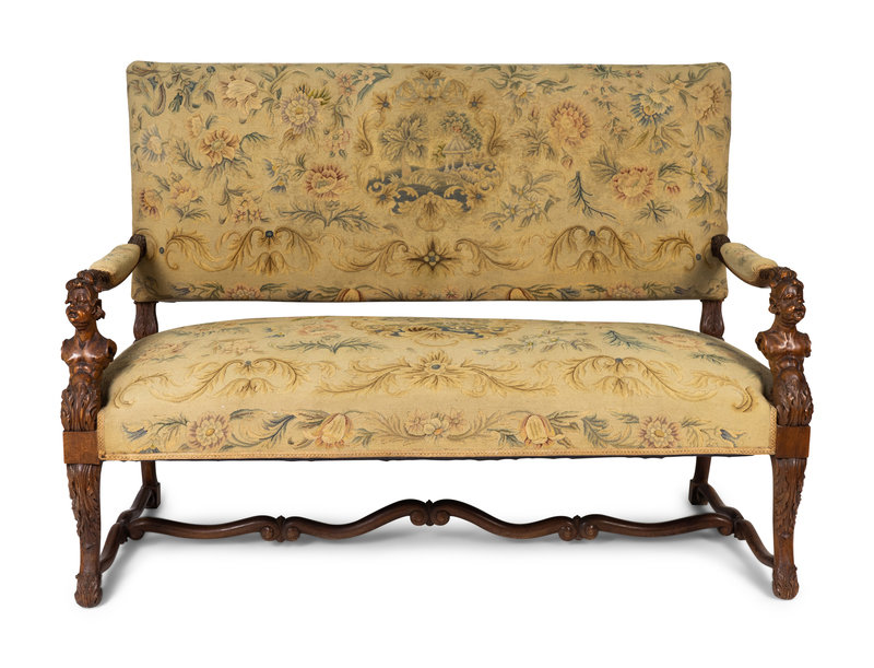 A Continental  Baroque Style Walnut Bench with  Needlepoint Upholstery
Height 43 x width 57 x depth 27 inches.
