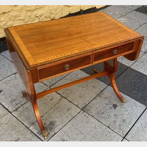 A FINE NEATLY SIZED CROSSBANDED REGENCY STYLE SOFA TABLE, with a pair of frieze drawers to one side, the drop