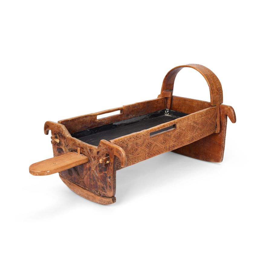An early 20th century Balkan carved wood cradle
