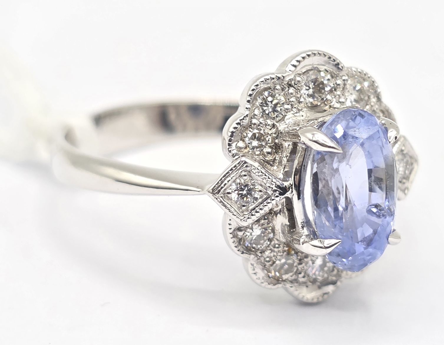 170 · 18CT GOLD SAPPHIRE AND DIAMOND CLUSTER RING