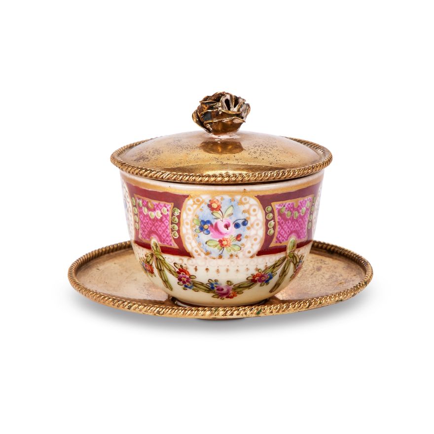 A small Meissen Marcolini period cup with silver gilt mounted lid & saucer