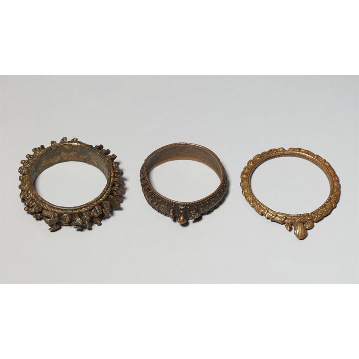 Three copper alloy bangles (virkangan). Central India, Maharashtra. 19th/20th century