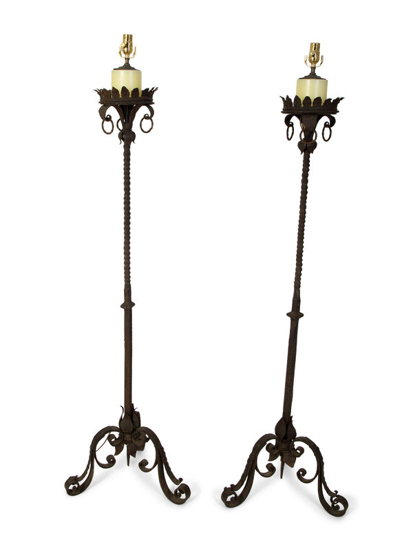 A Pair of Continental Wrought Iron Torcheres Mounted as Floor Lamps
Height 65 1/2 x diameter 22 inches.